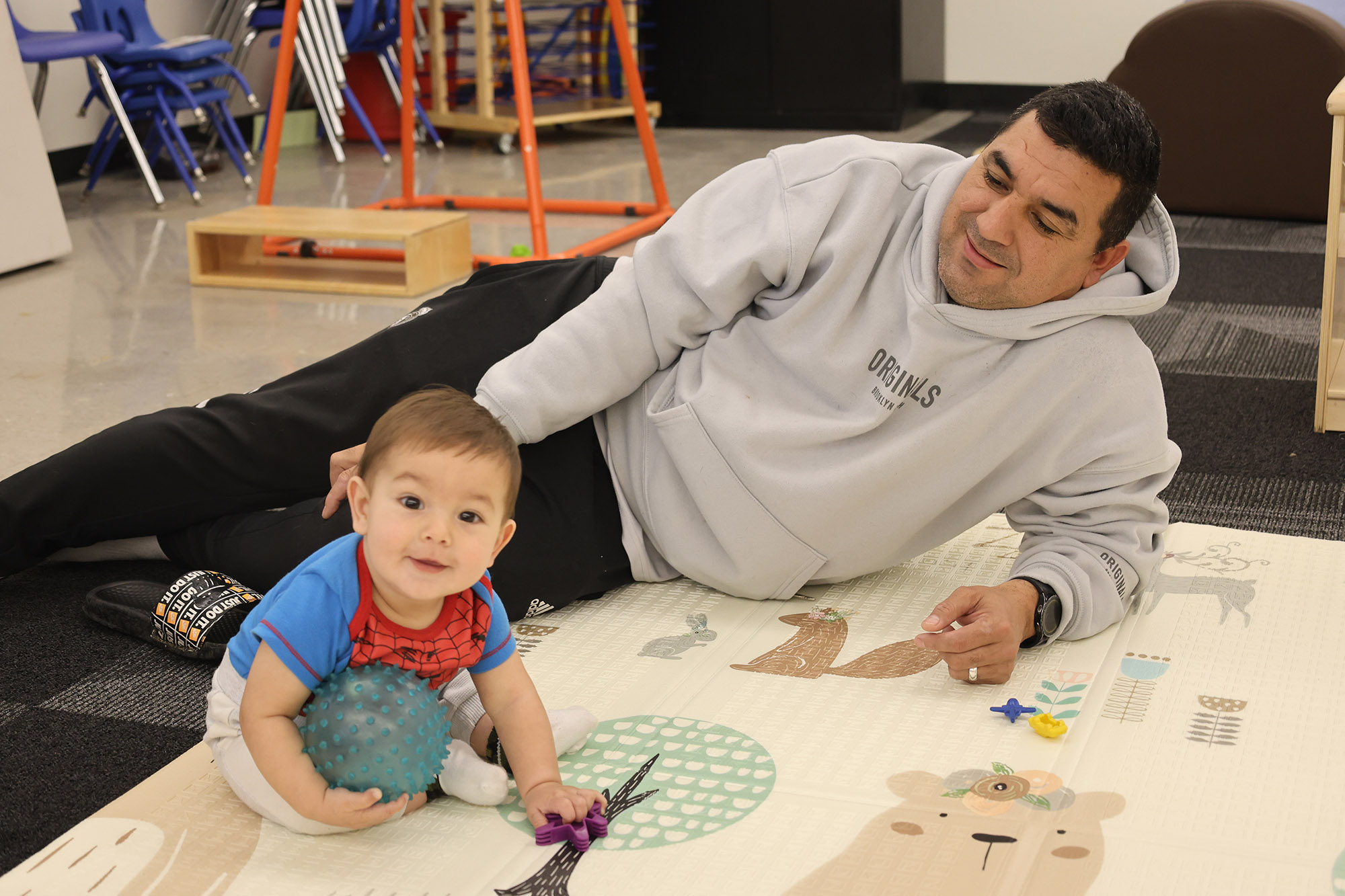 Father watching his son play